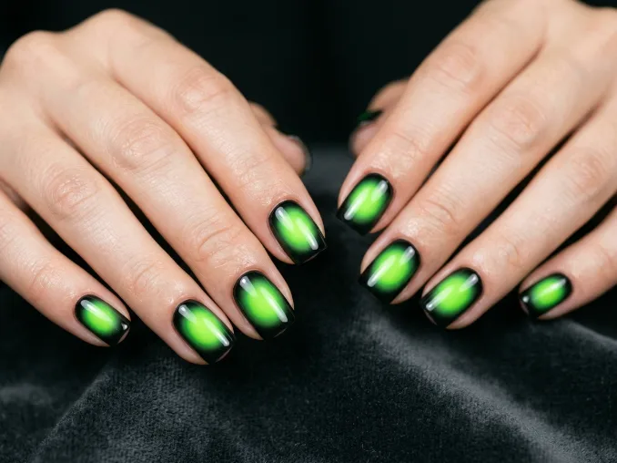 Neon aura / neon ombre nails featuring a black base with a glowing electric lime aura center