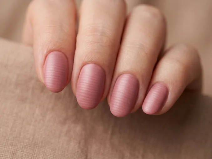 Tactile minimalism nail art with beautiful soft pink sculptural French nails and raised tips